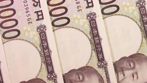 Lined up 10,000 yen bills close up, rotating Stock Footage 310864952