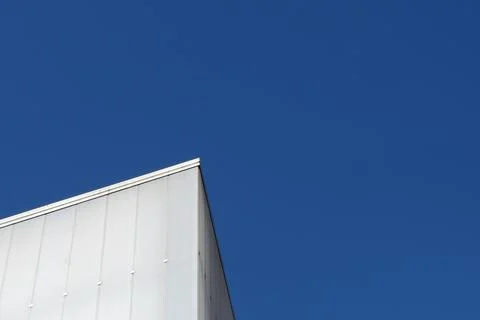 Lined architectural forms against clear blue sky. Architecture abstract bac.. Stock Photos