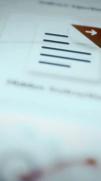 Lined document beneath a brown corner with white arrow Foto stock