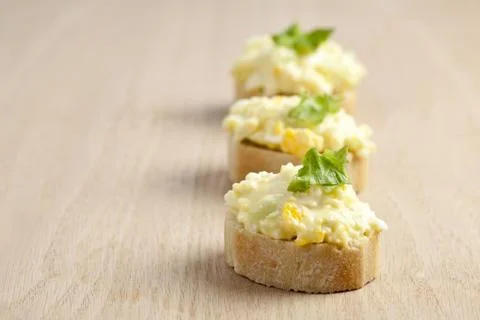 In lined egg sandwich with leafs Stock Photos