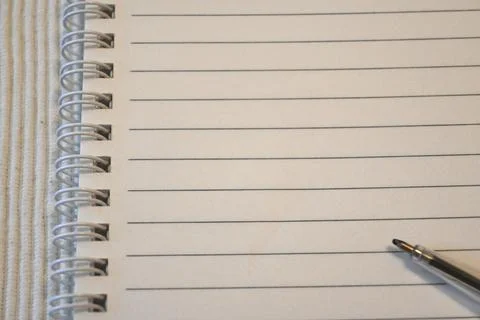 Lined notebook with pen Fotos Stock