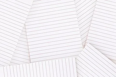 Lined paper strewn over surface Illustrazione stock