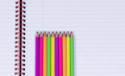 Lined up pencil tips on a spiral notebook background Stock-Fotos