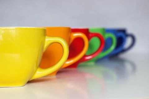 Lined Up Rainbow Cups Stock Photos
