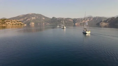 Lined Up Sailboats Drifting Between Islands 4K Video Stock Footage 150198473