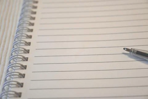 Lined spiral notebook with pen Fotos Stock