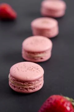Lined up strawberry macarons Stock Photos