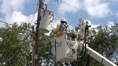 Lineman working on power pole bucket truck Stock Footage 96163571