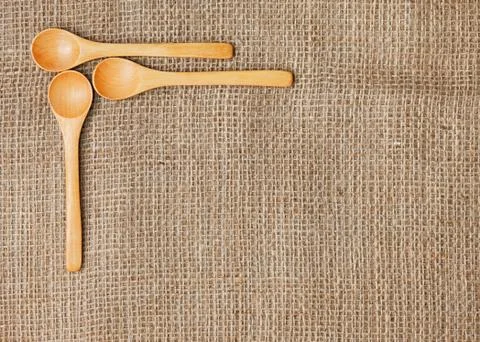 Linen background with spoon Stock Photos