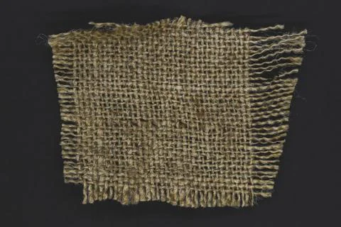 Linen canvas patch on black background 写真素材