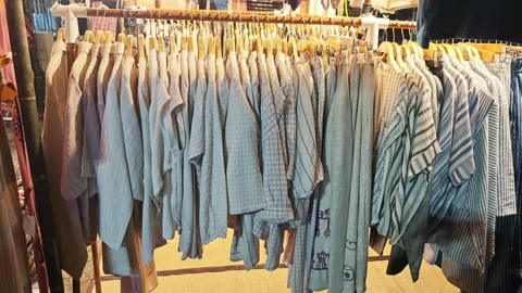 Linen clothes on a clothing rack. Stock Footage 341334787