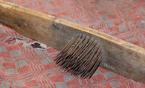 Linen. Manual processing of flax. Flax comb. Making linen at home Stock Photos