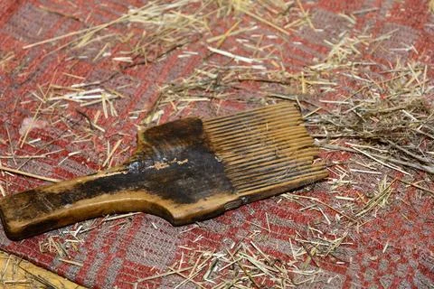 Linen. Manual processing of flax. Flax comb. Making linen at home Stock Photos