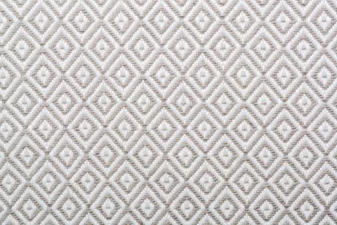 Linen napkin with a clear geometric pattern. Diamonds and squares. Stock-Fotos