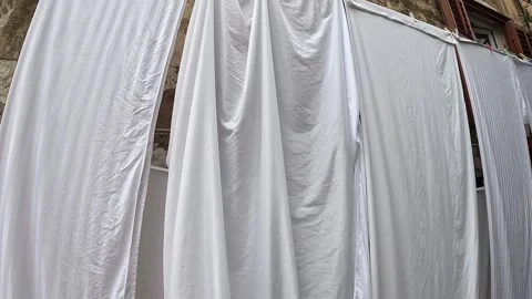 Linen sheets hanging out in the old city of Dubrovnik Stock Footage 255791118