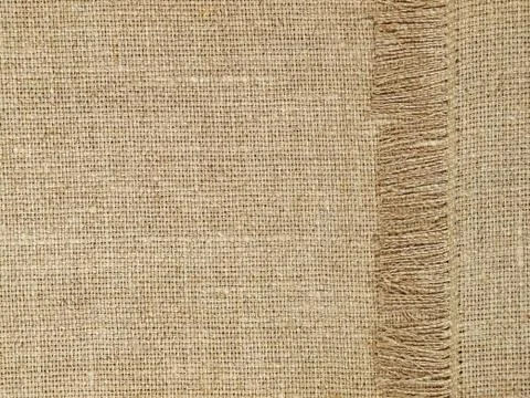 Linen texture pattern with fringe as background. Stock Photos