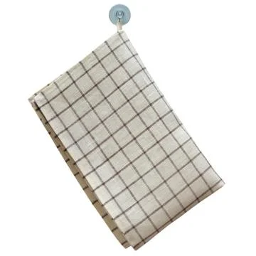 Linen towel weighing on the hook isolated on white background. 库存照片