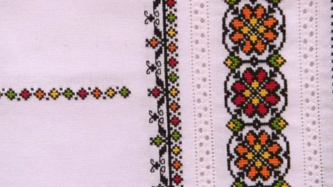 Linen white fabric with embroidered element. Ukrainian embroidery pattern. Stock Footage 250418726