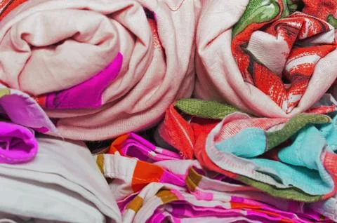 Linens rolled rolls piled stacks in a closet, cabinet furniture for home inte Stock Photos