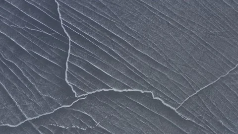 Lines across sheet of ice over Moosehead lake fresh snowfall Stock Footage 146730479