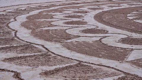 Lines and patterns drawn in the sand Stock Photos