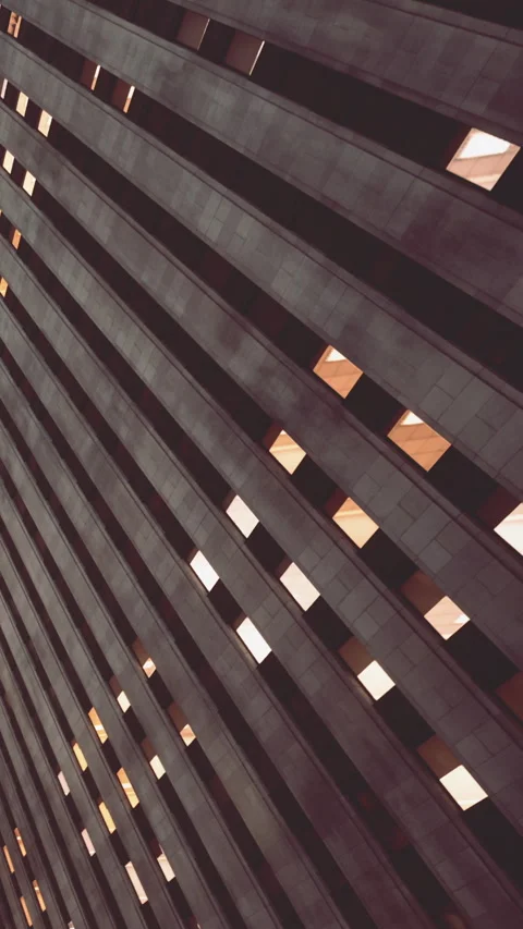 Lines and shapes form patterns in a modern building structure during daylight Stock Footage 342168926