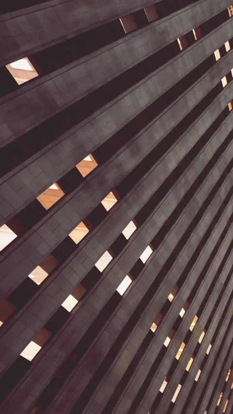 Lines and windows form a unique pattern in a modern building design Stock Footage 339105782