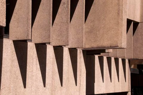 Lines, angles and shadows created by sunshine on brutalist architecture Stock Photos