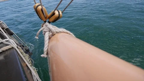 Lines being loosened on a square rigger sailing off the San Diego Coast Video stock 73937670