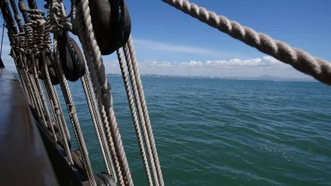 Lines being loosened on a square rigger sailing off the San Diego Coast Video stock 73937730