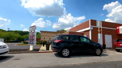 Lines at the Brusters Ice Cream retail store drive thru Stock Footage 144277158