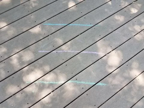 Lines of chalk on a wood deck Stock Photos