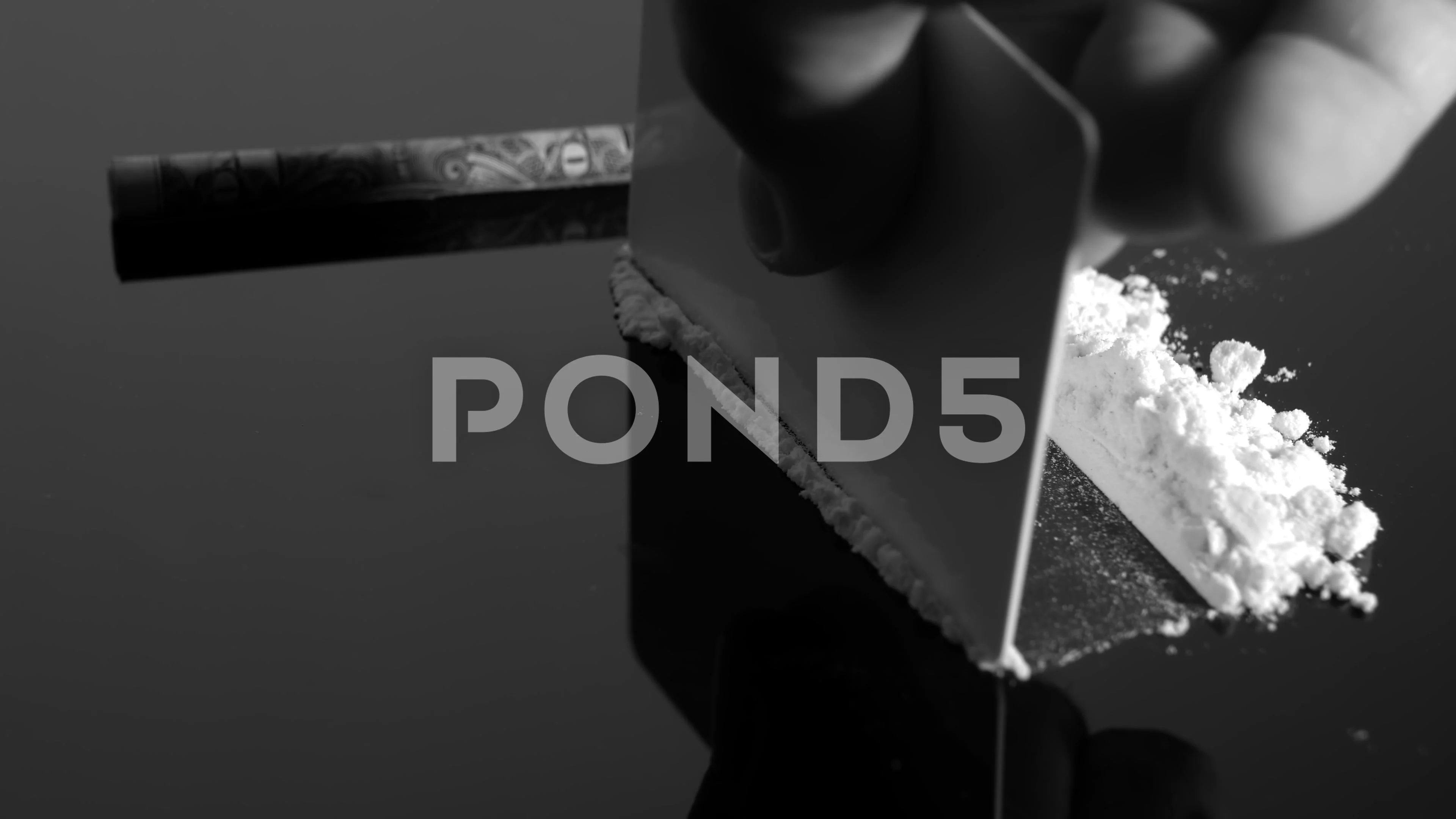 https://images.pond5.com/lines-cocaine-and-dollar-bill-footage-150556612_prevstill.jpeg