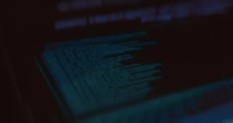 Lines of code, glowing blue text on a dark background Stock Footage 321751650