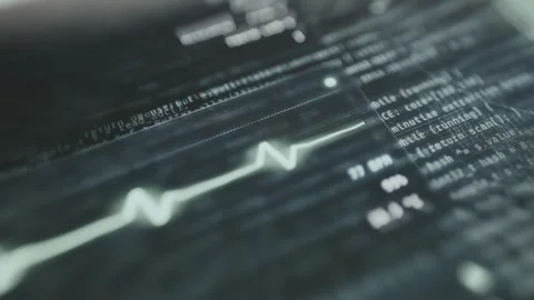 Lines of code intertwined with a heart rate monitor line Video stock 335458519
