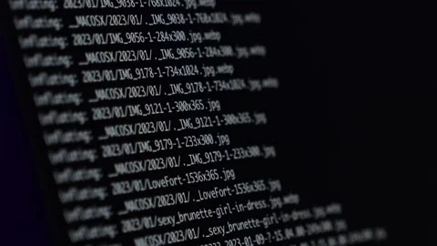 Lines of code moving rapidly on a dark screen with a zoom effect, creating a  Stock Footage 295380870