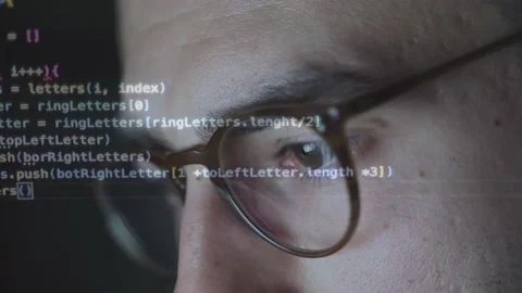 Lines of code reflected in glasses of software programmer and web developer Stock Footage 222816849