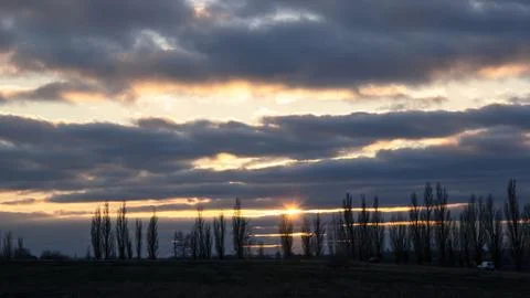 Lines of dramatic clouds at sunset, autumn Stock Photos