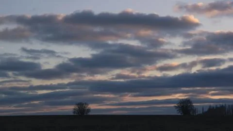 Lines of dramatic clouds at sunset, autumn Stock Photos