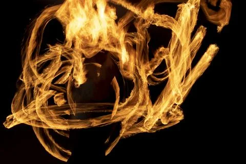 Lines of fire on black background. Flames in dark. Stock Photos