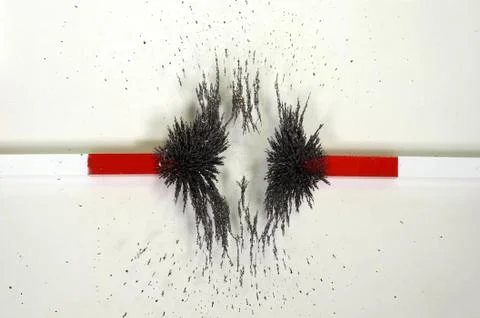 The lines of forces around two magnets with counteracting magnetic fields Stock Photos