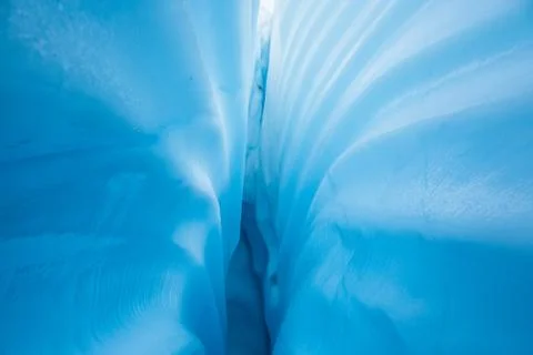 Lines in ice texture of inside a glacier crevasse in Alaska Stock Photos