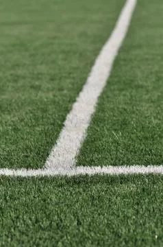 Lines intersect on a turf field of play. Stock Photos