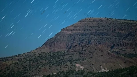 Lines over a Desert Mountain Cliff Star Trails Night Time Lapse Video stock 81887378