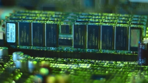 Lines of program code move by memory chips and other electronic components Stock Footage 313149374