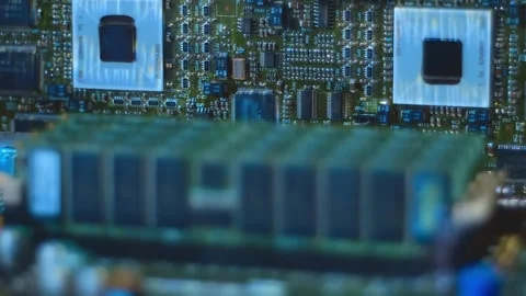 Lines of program code move by memory chips and other electronic components Stock Footage 313156196