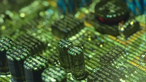 Lines of program code moves by a electronic elements on a circuit board Stock Footage 313150494