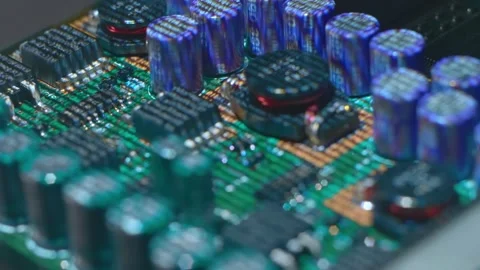 Lines of program code moves by a electronic elements on a circuit board Stock Footage 313220774