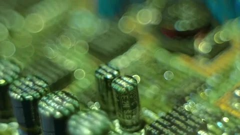 Lines of program code moves by a electronic elements on a circuit board Stock Footage 313231144