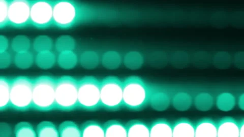 Lines of round Turquoise bokeh move horizontally. Видео 226139302
